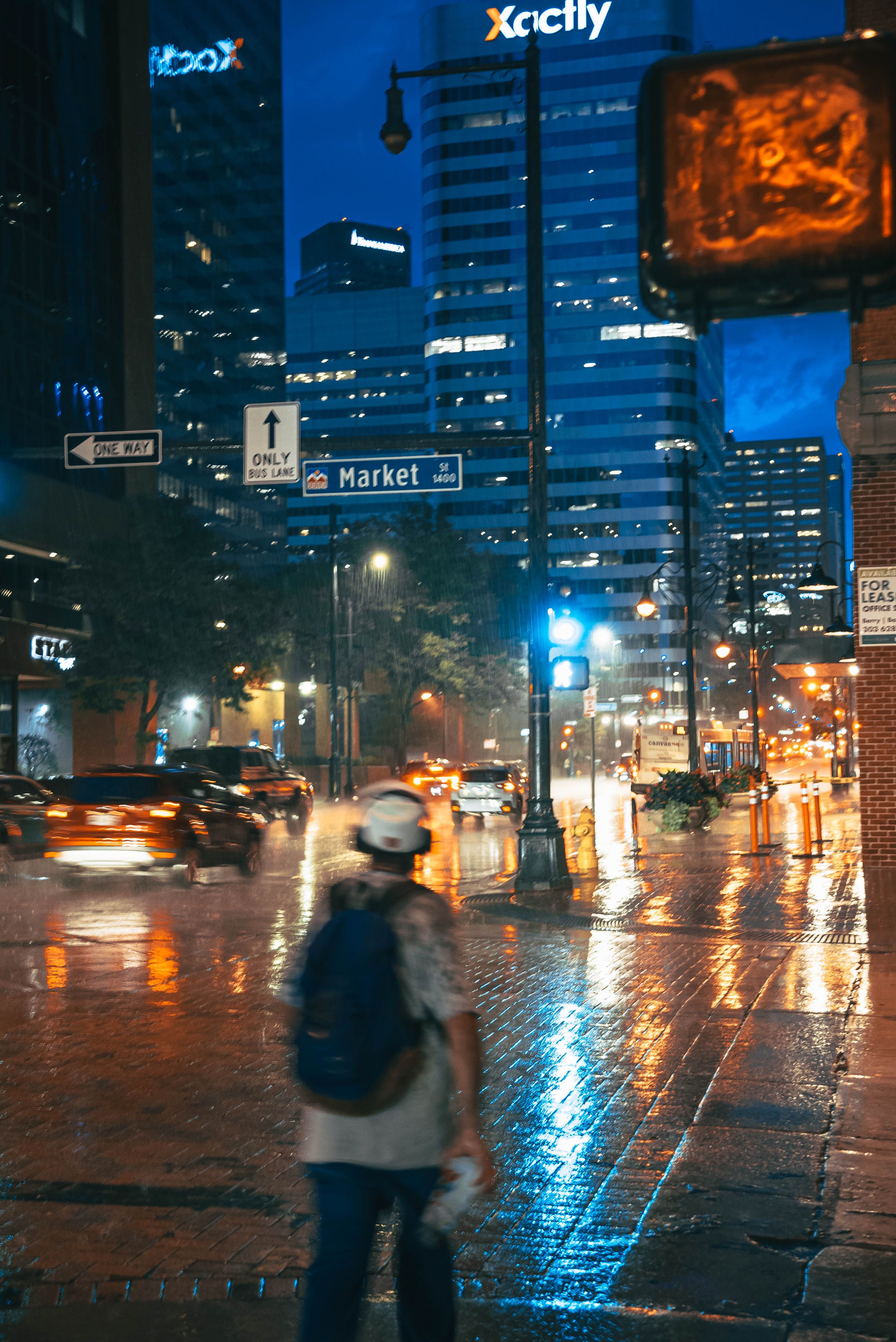 Things to do in Denver Colorado &mdash; downtown Denver street glowing at dusk